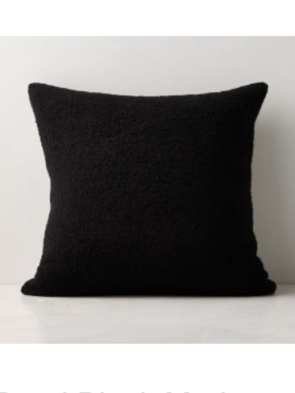 Two CB2 20x20in black boucle pillow covers
